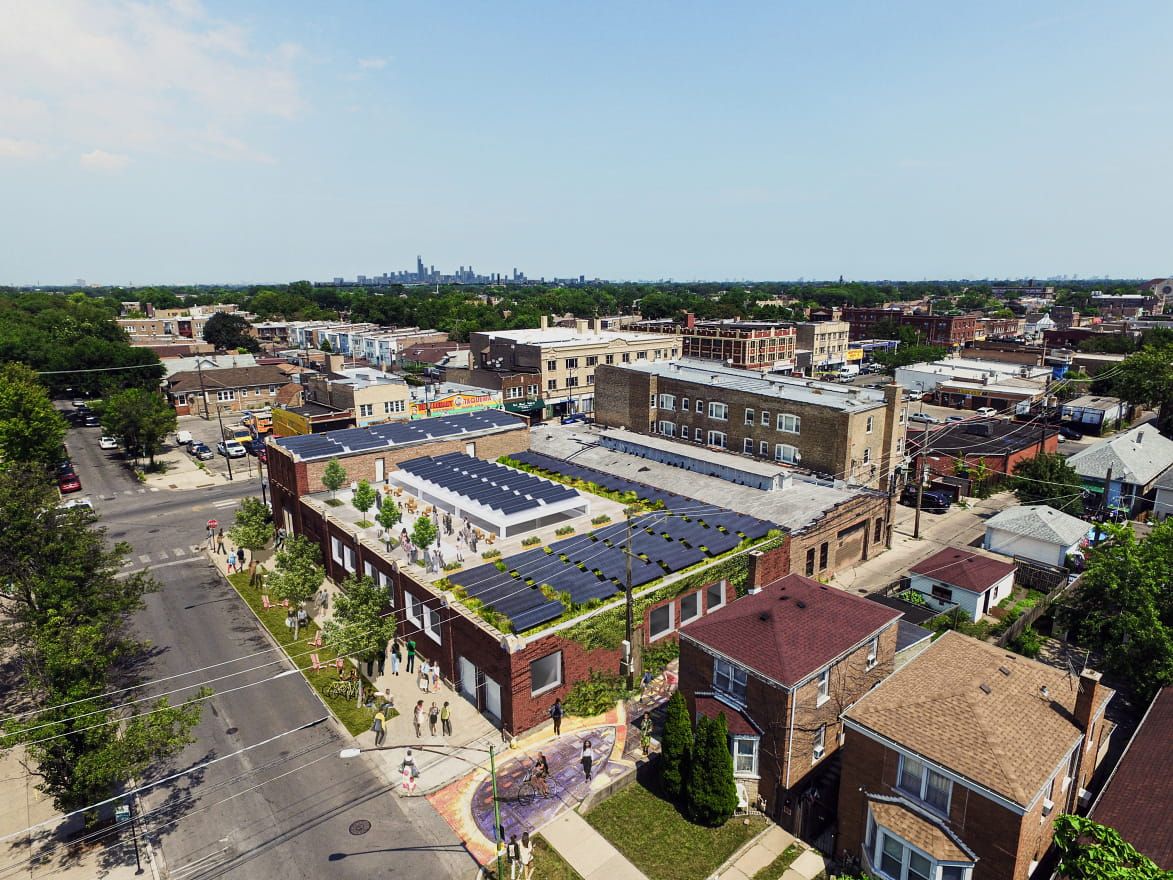 The aerial view of 63rd House and its rooftop covered with solar panels