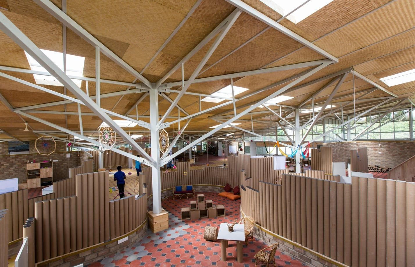 the interiors of the Atelier designed with cardboard tubes and tree-like structures