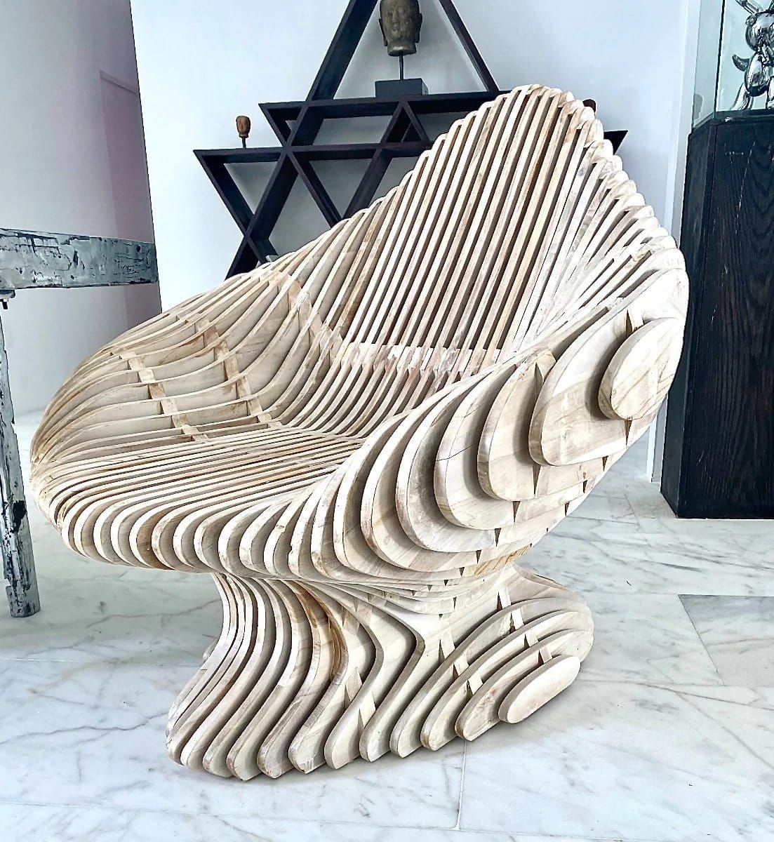 Parametric furniture called brevard chair created with irregularly shaped track pieces