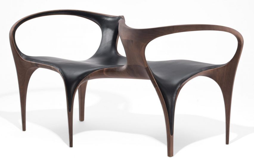 A photograph of the back-to-back chair from the UltraStellar collection by Zaha Hadid