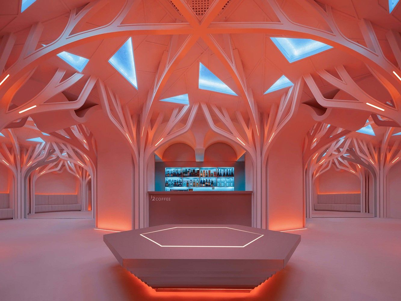 the bar and the hexagonal seating under the parametric ceiling