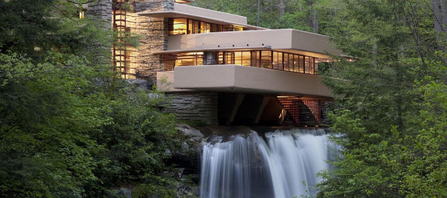 An exterior view of Fallingwater house together with the waterfall