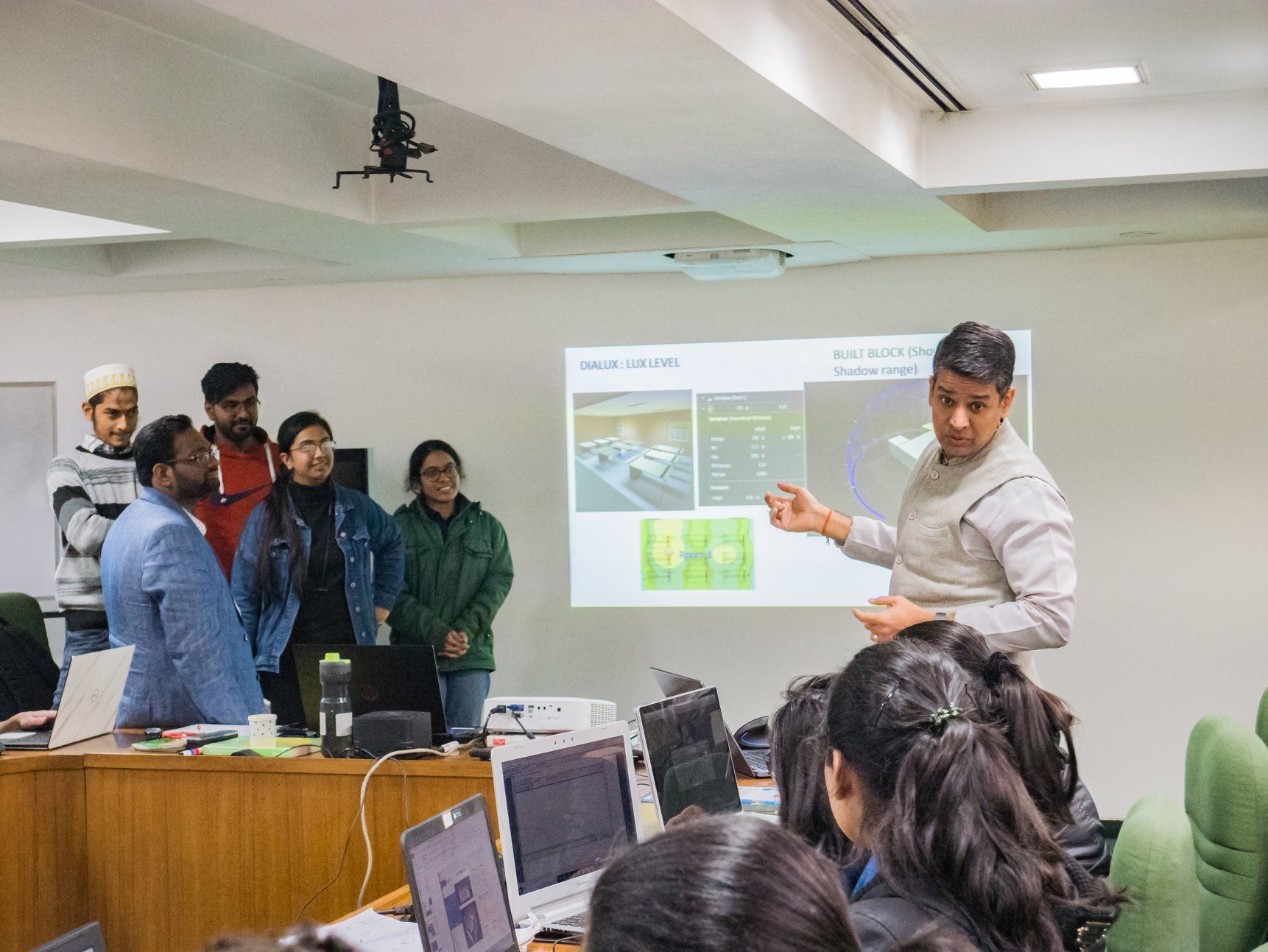 A professor giving a presentation to a group of students