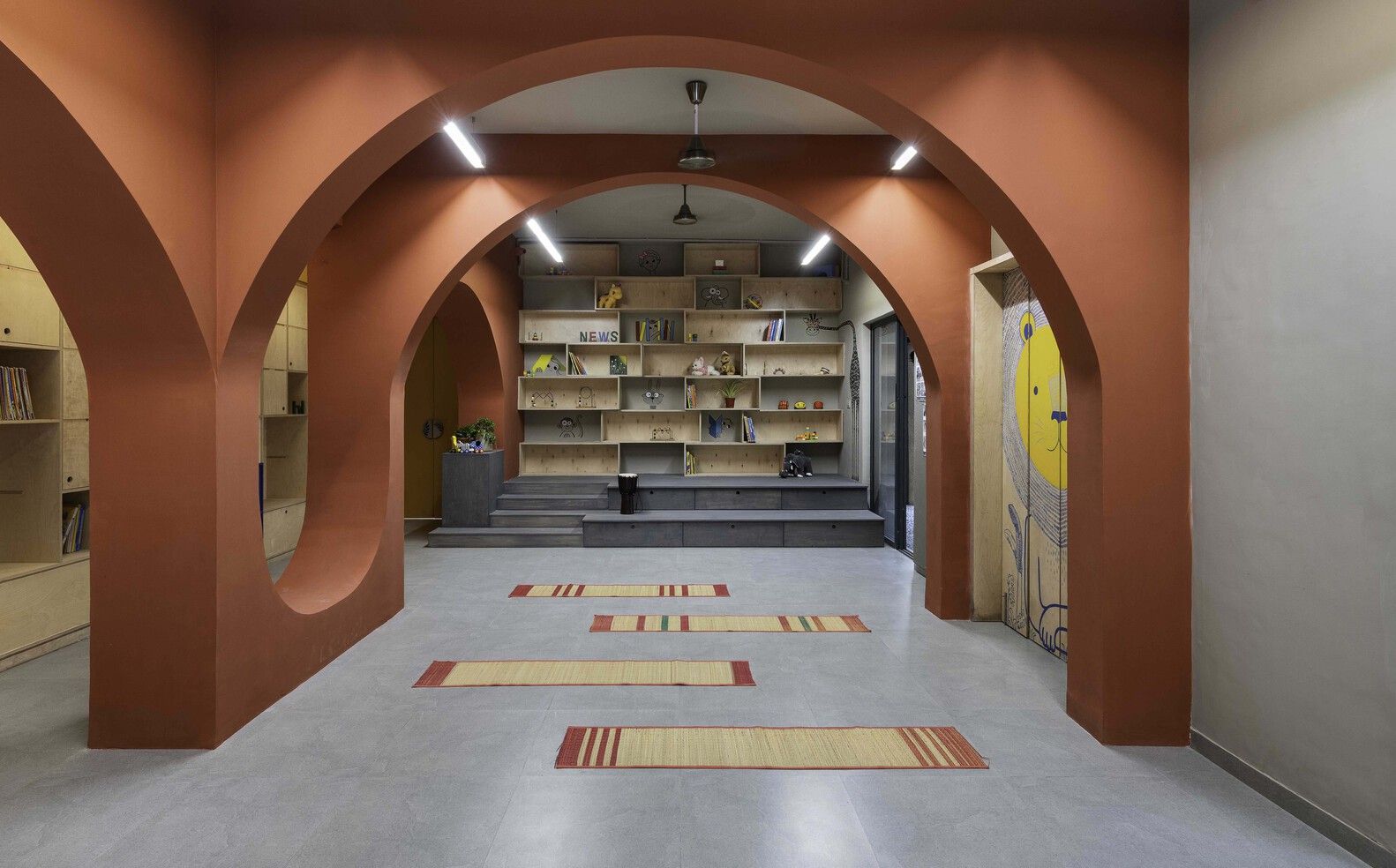 red arched walls inside a classroom of The Out School