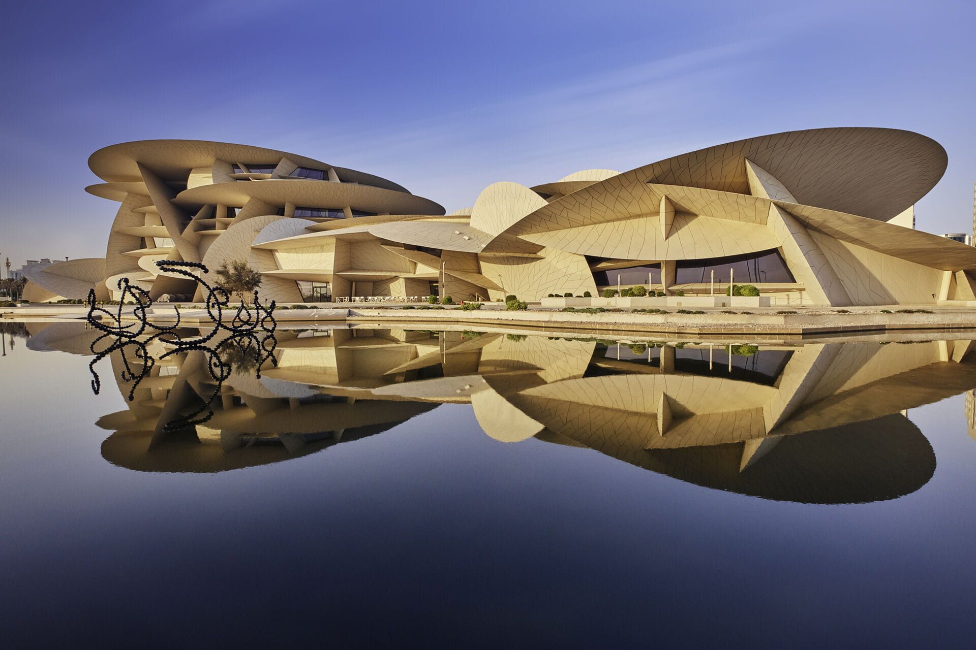 National Museum of Qatar reflected in the pond