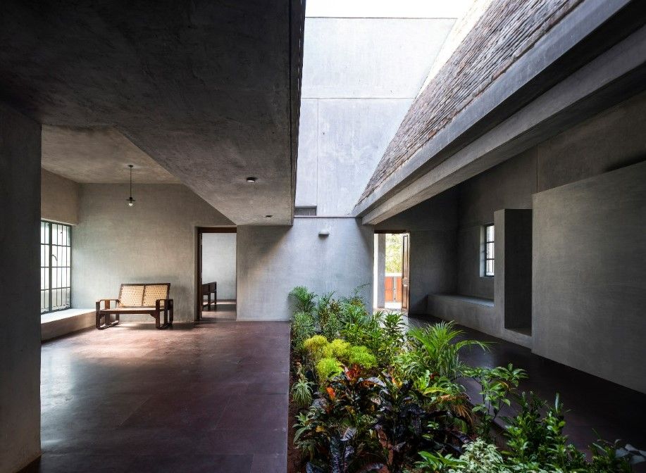 Image overlooking the central open courtyard surrounded by the grey tones of the Court House