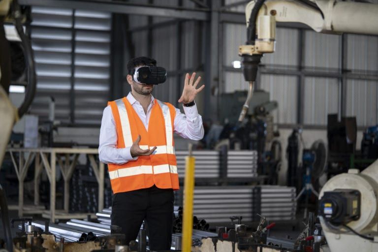 A construction worker using Virtual Reality tools at a Construction Site
