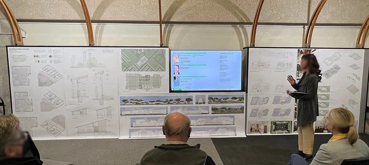  A student presenting her architecture thesis project in front of the faculty