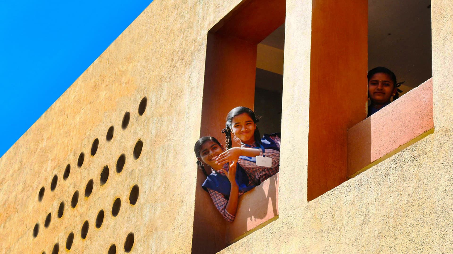 Students peeking from the Vasant Vidyalaya